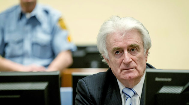 Bosnian Serb wartime leader Radovan Karadzic sits in the courtroom for the reading of his verdict at the International Criminal Tribunal for Former Yugoslavia (ICTY) in The Hague, on March 24, 2016/AFP