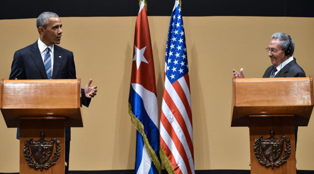 US President Barack Obama speaks during a joint press conference with Cuban President Raul Castro (R) after a meeting at the Revolution Palace in Havana on March 21, 2016/AFP