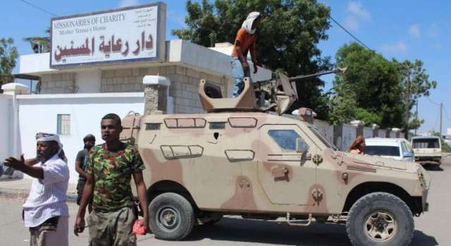 Yemeni security forces gather outside an elderly care home in Yemen's main southern city of Aden after it was attacked by gunmen/AFP