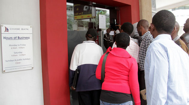 Dozens of the bank’s customers have been standing outside designated branches around the city reading and re-reading the Central Bank’s statement glued on the bank’s doors/MIKE KARIUKI