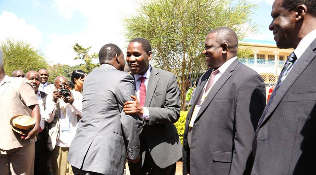 Former PM Raila Odinga is welcomed to the conference by CoG Chairman Peter Munya/COURTESY