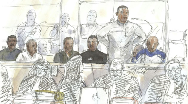 A court sketch made on March 29, 2016 shows seven suspected Somali pirates attending their trial in the courthouse in Paris, over the hijacking of a French yacht/AFP