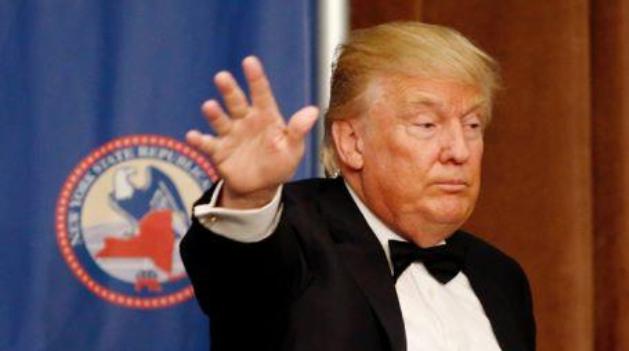 Republican presidential candidate Donald Trump waves to the guests after speaking during the 2016 annual New York State Republican Gala in New York/AFP