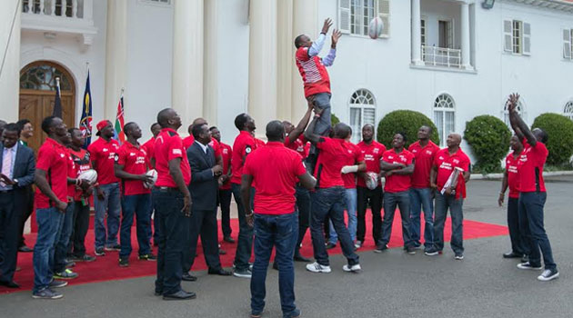 The President received a thunderous applause from the players and guests after successfully plucking the ball off the air and offloading it to the Sports, Arts and Culture Cabinet Secretary Hassan Wario/PSCU