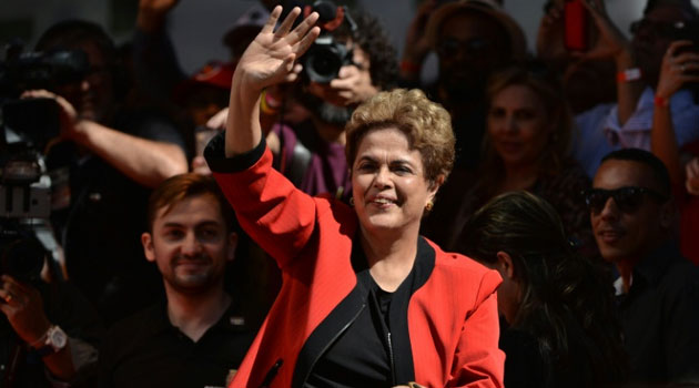  waves at the crowd during a demonstration to mark International Workers' Day, in Sao Paulo, Brazil, on May 1/FILE