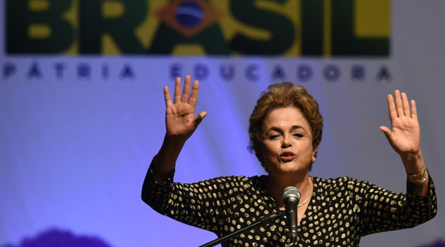 Brazilian President Dilma Rousseff is accused of breaking budgetary laws by taking loans to boost public spending and mask the sinking state of the economy/AFP