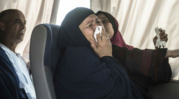 Family members of the EgyptAir flight that crashed in the Mediterranean are transported to Cairo airport on May 19, 2016/AFP