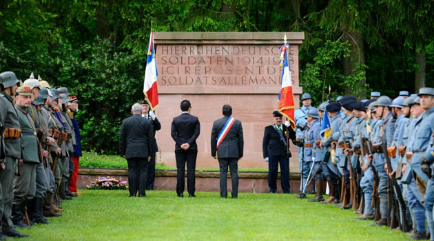 Reenactors dressed as French and German soldiers gather at the German WWI cemetery of Troyon, eastern France, as part of the 100-year commemoration of the Battle of Verdun/AFP