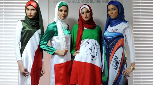 FILE PHOTO: Iranian models present outfits bearing the national flag's colors and other World Cup-linked designs in Tehran on June 24, 2014 /AFP