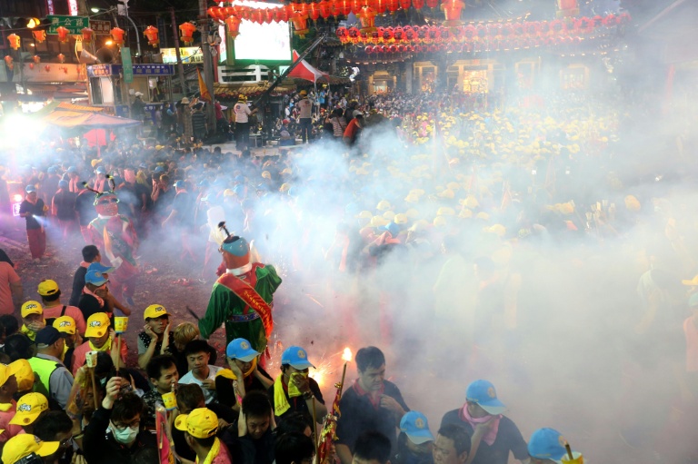 The potential damage to the environment and to the health of devotees from staggering levels of dangerous particles in the air/AFP