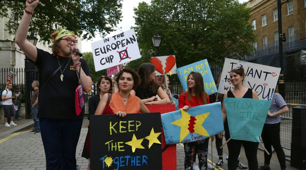 A small group of anti-Brexit demonstrators protest opposite Downing Street in central London following the UK's decision to leave the EU/AFP