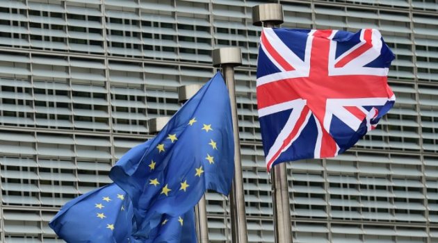 A British flag flies with EU flags at the European Commission in Brussels/AFP