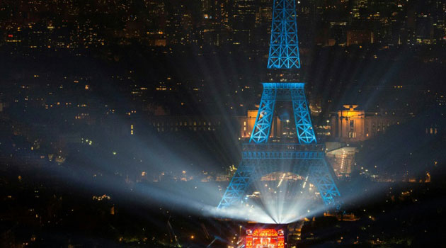 A picture taken on June 9, 2016 from the Montparnasse tower shows the opening concert of the Paris fan zone on the Champs de Mars by the Eiffel Tower, in Paris, one day before the start of the Euro 2016 football championship/AFP