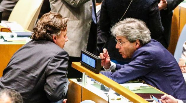 Dutch Foreign Minister Bert Koenders (L) speaks with Italian Foreign Minister Paolo Gentiloni after the fourth round of voting during the election of five non-permanent members of the Security Council at the United Nations in New York on June 28 2016/AFP