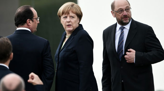 Germany's Chancellor Angela Merkel (C) will host the leaders of France, Italy and the EU in Berlin on Monday to discuss the Brexit crisis/FILE