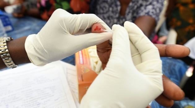 A health official tests for malaria, a disease that killed more than 400,000 people worldwide in 2015, with most of the deaths occurring in sub-Saharan AfricaAFP-File