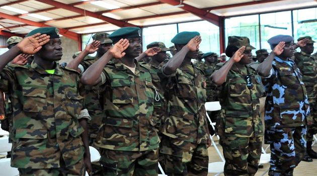 Uganda People’s Defense Forces (UPDF) soldiers salute/AFP-File