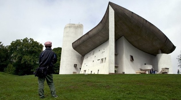 On the heritage list soon? In this file photo, a visitor looks at Notre-Dame-du-Haut chapel designed by Le Corbusier/AFP-File