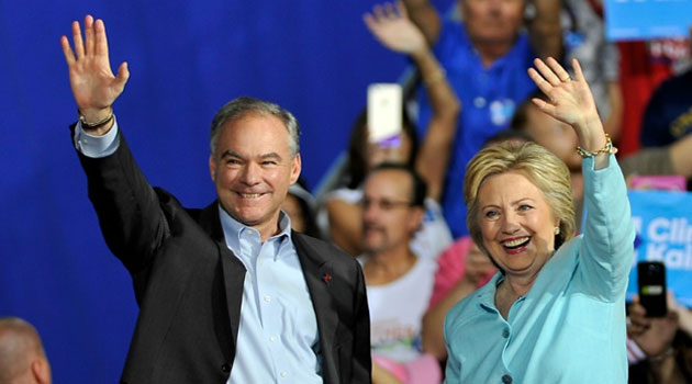 US Democratic presidential candidate Hillary Clinton and running mate Tim Kaine greet supporters at a campaign rally in Miami on July 23, 2016/AFP