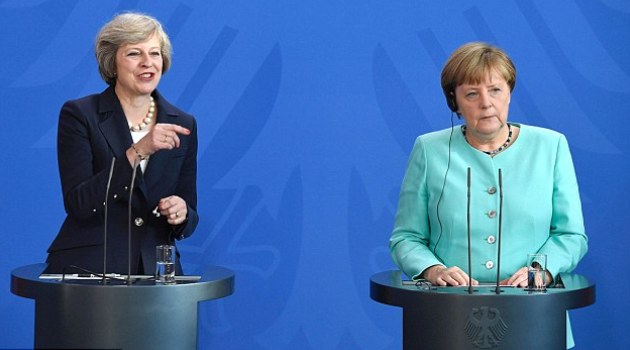 Theresa May and Angela Merkel held a joint press conference tonight after their first talks since Britain's new Prime Minister took office and responsibility for ensuring 'Brexit is Brexit'/AFP