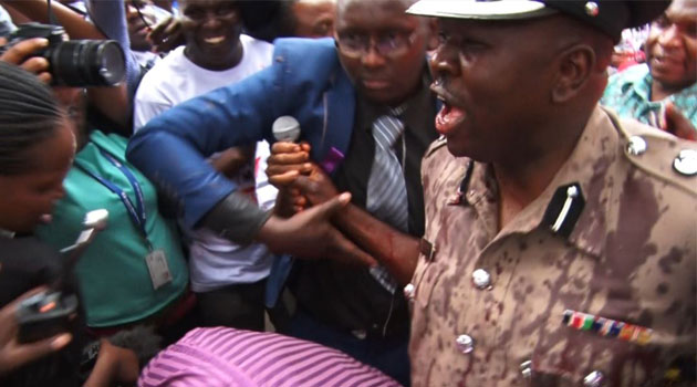 Police Spokesman Charles Owino who received the petition also received his share of red paint/KEVIN GITAU