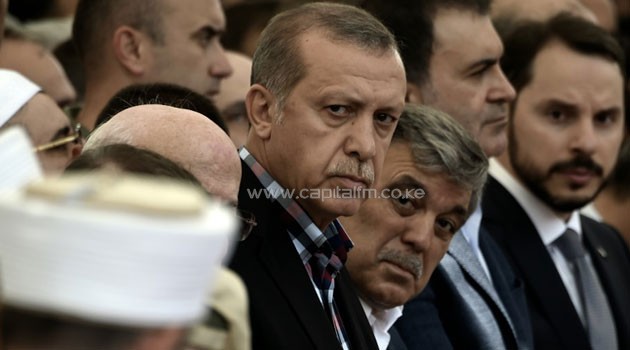 Turkish President Recep Tayyip Erdogan and former Turkish president Abdullah Gul attend the funeral of a victim of the coup attempt in Istanbul on July 17, 2016/AFP