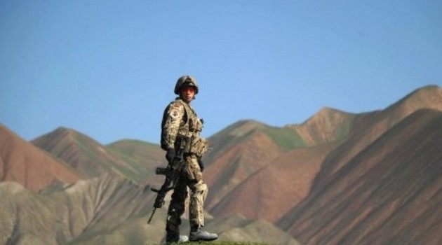 A German soldier keeping watch during a patrol near Taloqan, the capital of Takhar province in Afghanistan on April 2, 2012/(AFP