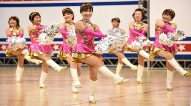 Members of the middle-aged and elderly women's cheerleading group 'Japan Pom Pom' perform during the national cheerleading and dance championship 2016 of the United Spirit Association in Yokyo, Japan/AFP