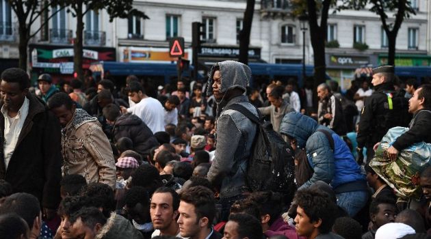 Police moved in at dawn to remove the migrants, mainly from Sudan, Eritrea and Afghanistan, who were sleeping in tents and on mattresses in the camp in northern Paris/AFP