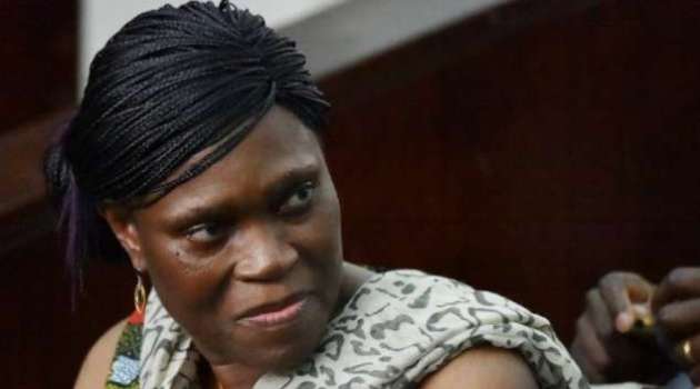 Former Ivorian first lady Simone Gbagbo looks on at Abidjan's courthouse on October 10, 2016 before the re-opening of her trial, which her lawyers said October 24, 2016 they would refuse to participate in "until further notice"/AFP