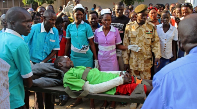 One of around 50 injured patients who were evacuated to Juba on flights provided by the Red Cross, the South Sudanese government and the UN arrives at Juba hospital/AFP