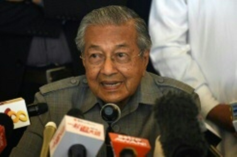 Hardliner, 92, back as Malaysia's PM in shock election win