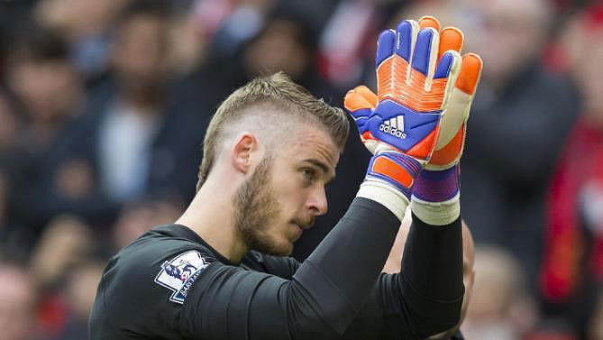 Manchester United keeper, David de Gea applauds after their victory against Arsenal at the Emirates. He has been linked to a move to Real Madrid