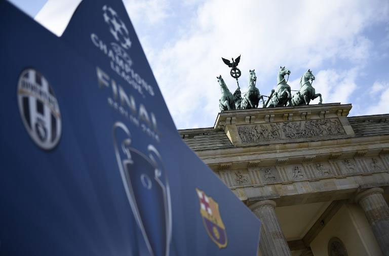 An advertisement to promote the UEFA Champions League final is seen next to Berlin's landmark Brandenburg Gate.