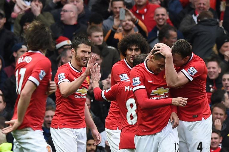 Manchester United players celebrate a goal against Chelsea. PHOTO/File