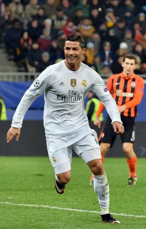 Real Madrid's forward Cristiano Ronaldo celebrates after scoring during a UEFA Champions League match against Shakhtar Donetsk in Lviv on November 25, 2015. PHOTO/AFP