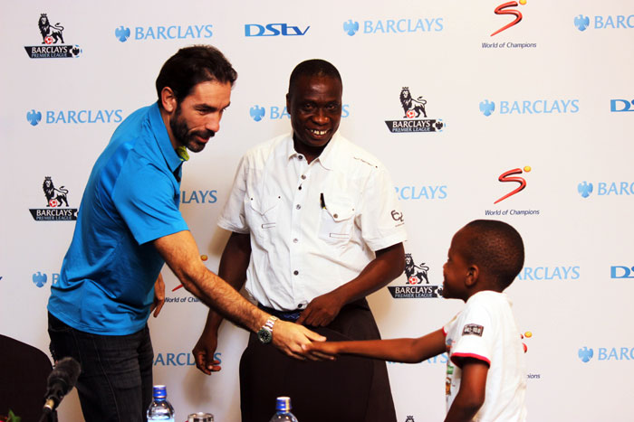 Arsenal legend, Robert Pires, greets a young fan upon arrival to Nairobi for a three-day visit. PHOTO/Courtesy