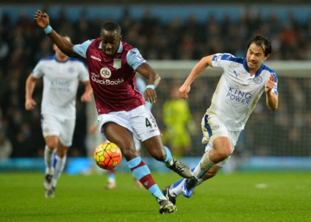 eicester City's Shinji Okazaki (R) vies with Aston Villa's Aly Cissokho during the English Premier League match in Birmingham on January 16, 2016