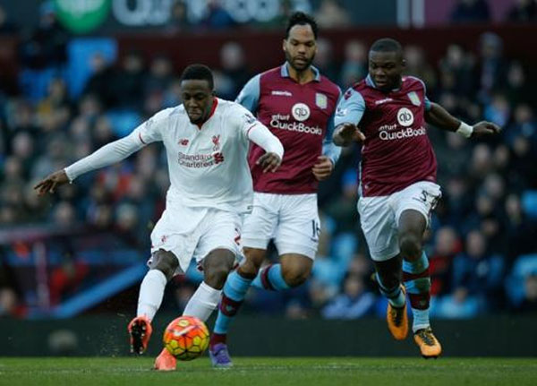 Liverpool's Belgian striker Divock Origi (left) scores his team's fourth goal during the English Premier League match against Aston Villa at Villa Park in Birmingham on February 14, 2016