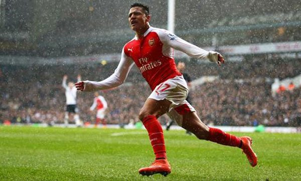 Arsenal battled back from Francis Coquelin's red card to secure a 2-2 derby draw against Tottenham thanks to Alexis Sanchez.
