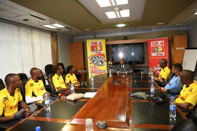 Capital Group Limited Chairman Dr Chris Kirubi has a chat with the team upon return from Anfield/PHOTO-Susan Wong