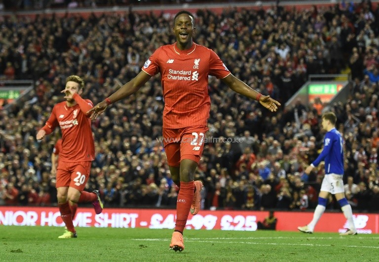 Liverpool's striker Divock Origi (C) celebrates after scoring during the English Premier League match against Everton on April 20, 2016. PHOTO/AFP.