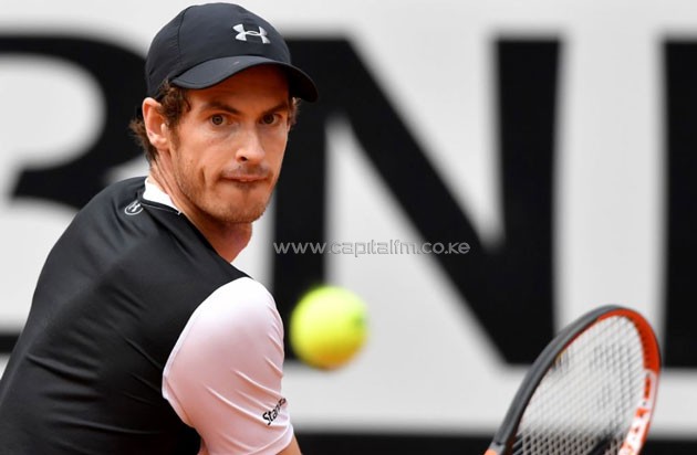 Britain's Andy Murray hits a return against France's Lucas Pouille during the ATP Tennis Open tournament semi-final at the Foro Italico on May 14, 2016 in Rome (AFP Photo/Tiziana Fabi)
