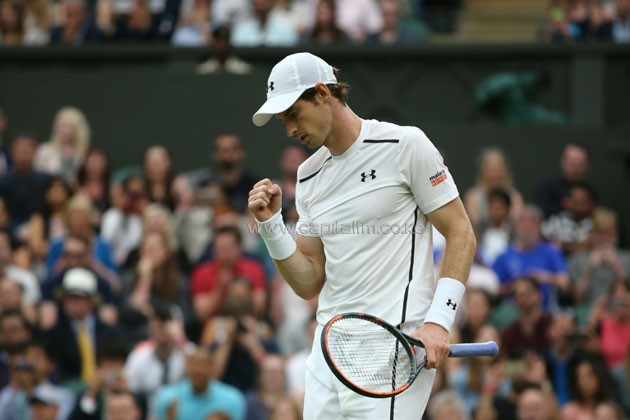 Britain's Andy Murray celebrates beating Australia's John Millman in their men's singles third round match on the sixth day of the 2016 Wimbledon Championships at The All England Lawn Tennis Club in Wimbledon, southwest London, on July 2, 2016.PHOTO/AFP