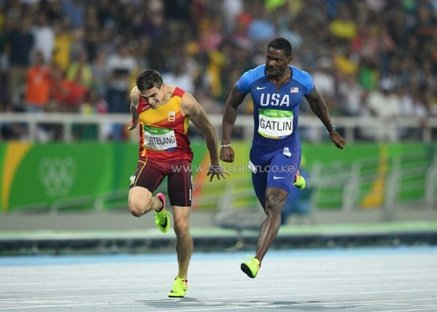USA's Justin Gatlin (R) tied up late in his semi-final, only finishing third in 20.13sec and missing out on one of the eight final berths in the men's 200m.