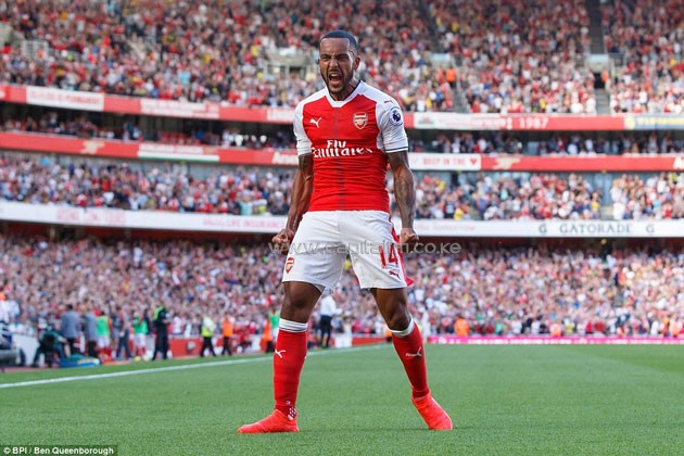 Walcott roars in front of the home fans having scored for the Gunners in the Premier League clash with Liverpool.PHOTO/courtesy.