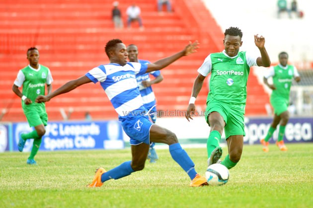 Gor Mahia's George 'Blackberry' Odhiambo attempts to go past AFC Leopards defender Joshua Mawira. PHOTO/Raymond Makhaya