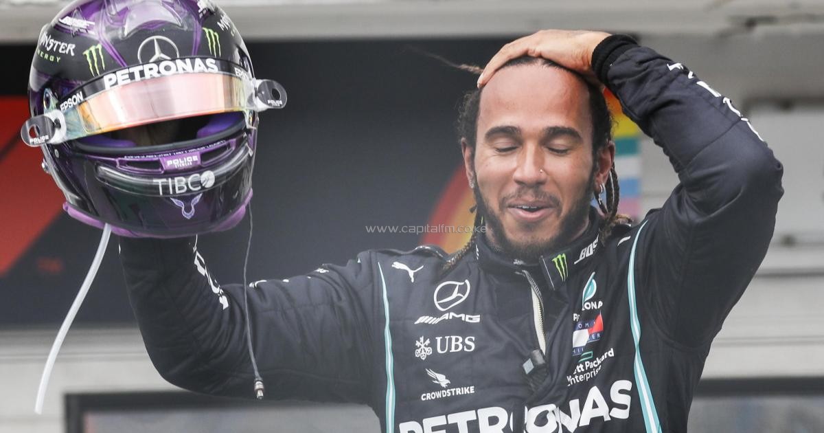 Hamilton claims record win and top spot in title race