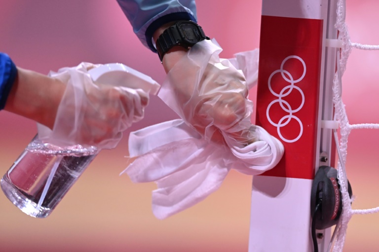 Olympic organisers defend coronavirus measures as cases rise