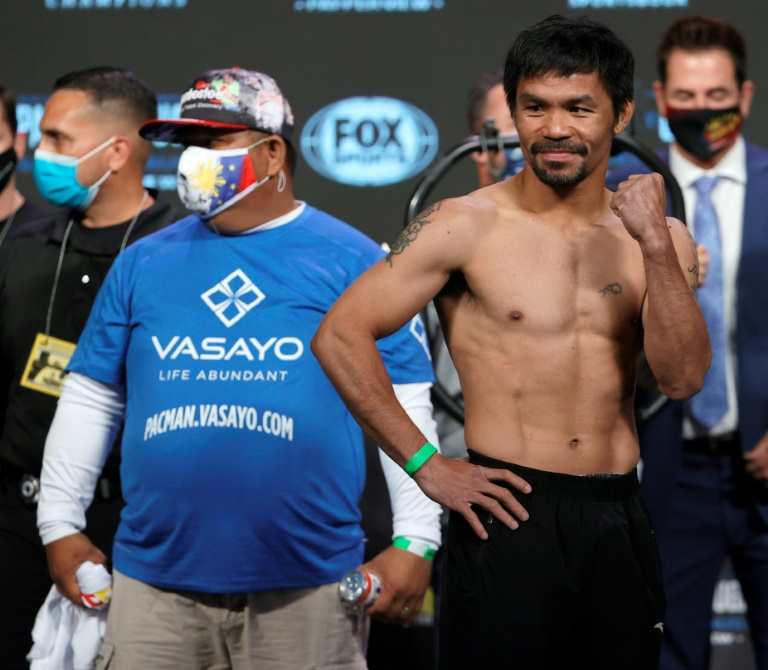 Pacquiao makes weight for welterweight title fight